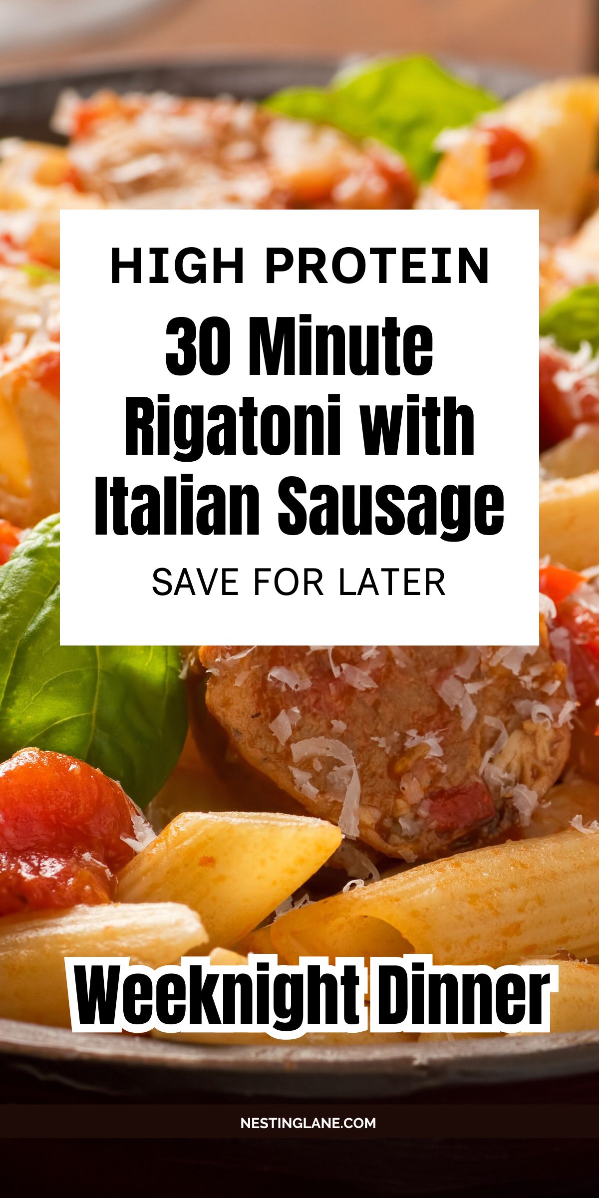 Close-up of rigatoni pasta with Italian sausage meatballs, cherry tomatoes, basil leaves, and grated cheese in red sauce. Text overlay reads: “HIGH PROTEIN 30 Minute Rigatoni with Italian Sausage SAVE FOR LATER” and “Weeknight Dinner.” Bottom text says “NESTINGLANE.COM”.