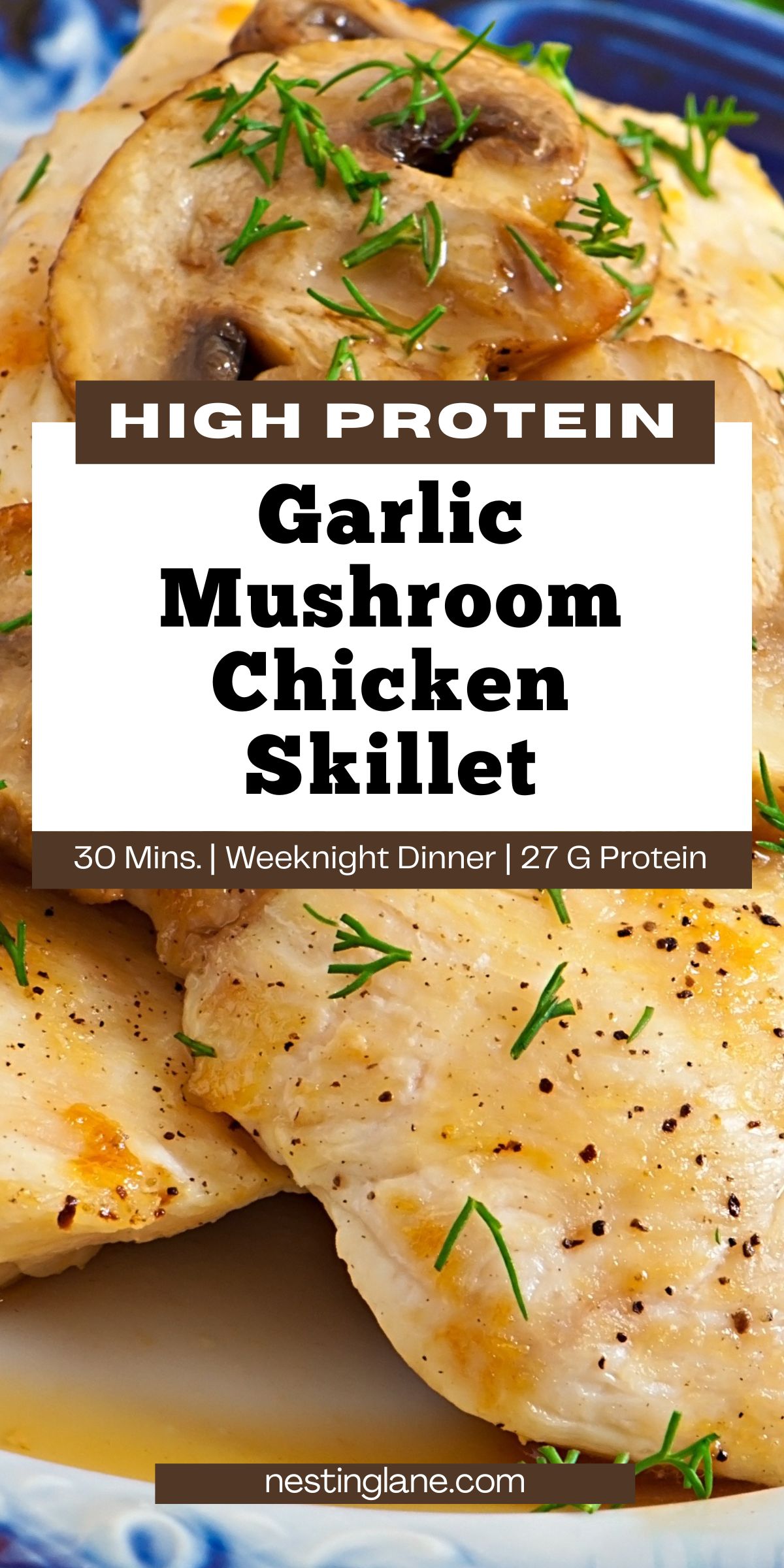 Close-up of garlic mushroom chicken skillet with seared chicken breasts topped with sliced mushrooms, herbs, and black pepper in a savory pan sauce. Text reads: “HIGH PROTEIN Garlic Mushroom Chicken Skillet” and “30 Mins. | Weeknight Dinner | 27 G Protein” with “nestinglane.com” at the bottom.