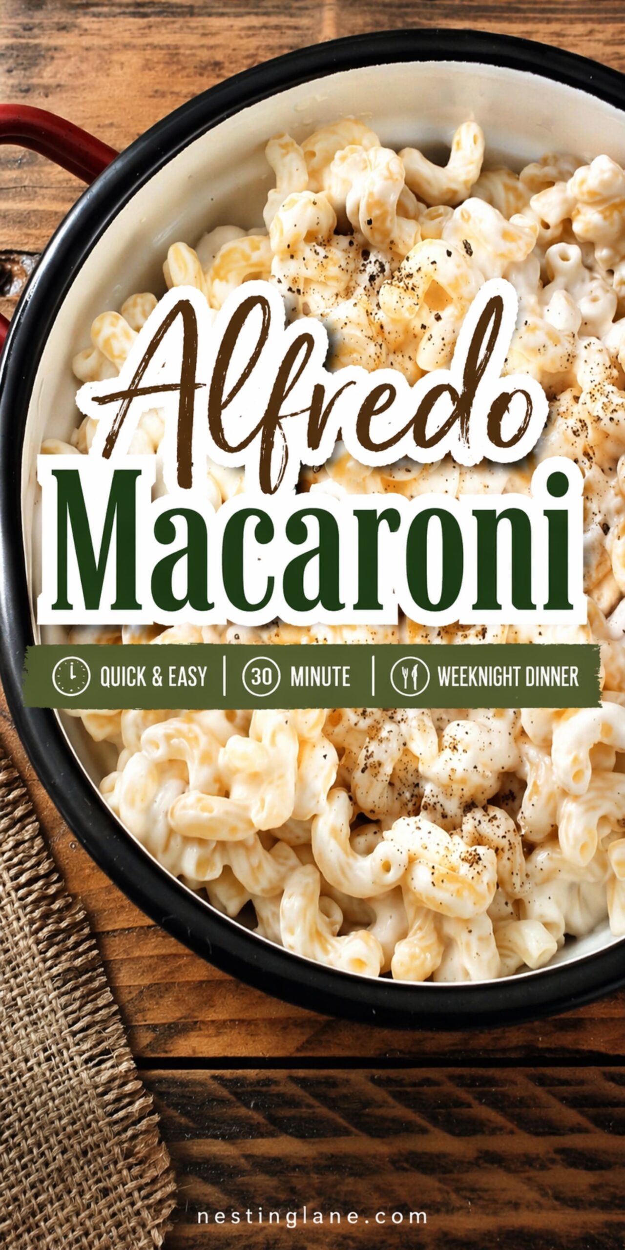 Creamy Alfredo macaroni in a white enamel pot with black pepper on top, set on a rustic wood table. Text reads: “Alfredo Macaroni” and “Quick & Easy | 30 Minute | Weeknight Dinner.” Small text at bottom says “nestinglane.com.”
