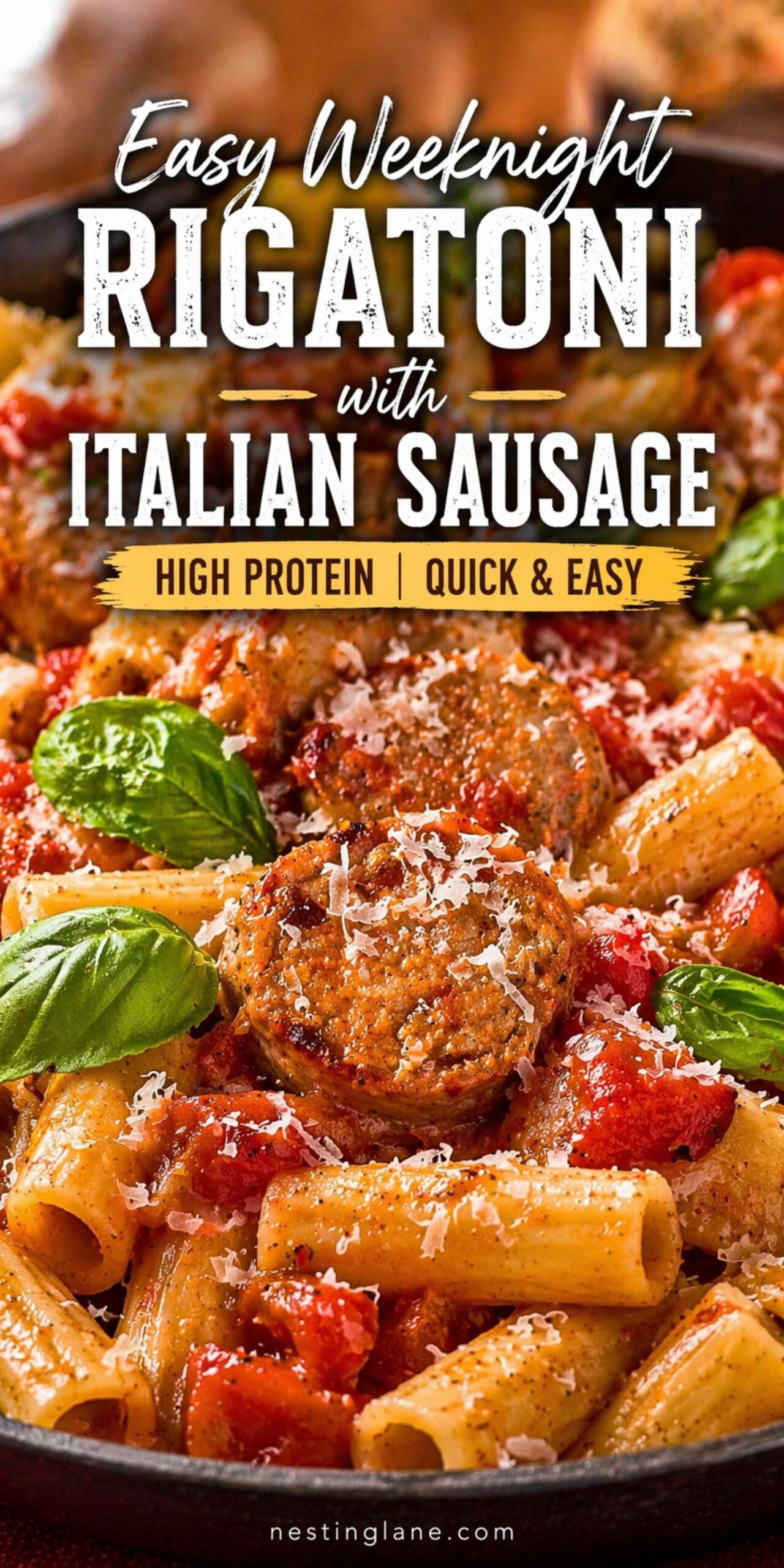 Close-up of rigatoni pasta with Italian sausage, tomato sauce, grated Parmesan, and fresh basil in a skillet. White and yellow text reads: “Easy Weeknight Rigatoni with Italian Sausage” and “High Protein | Quick & Easy.” Small text at bottom says “nestinglane.com.”