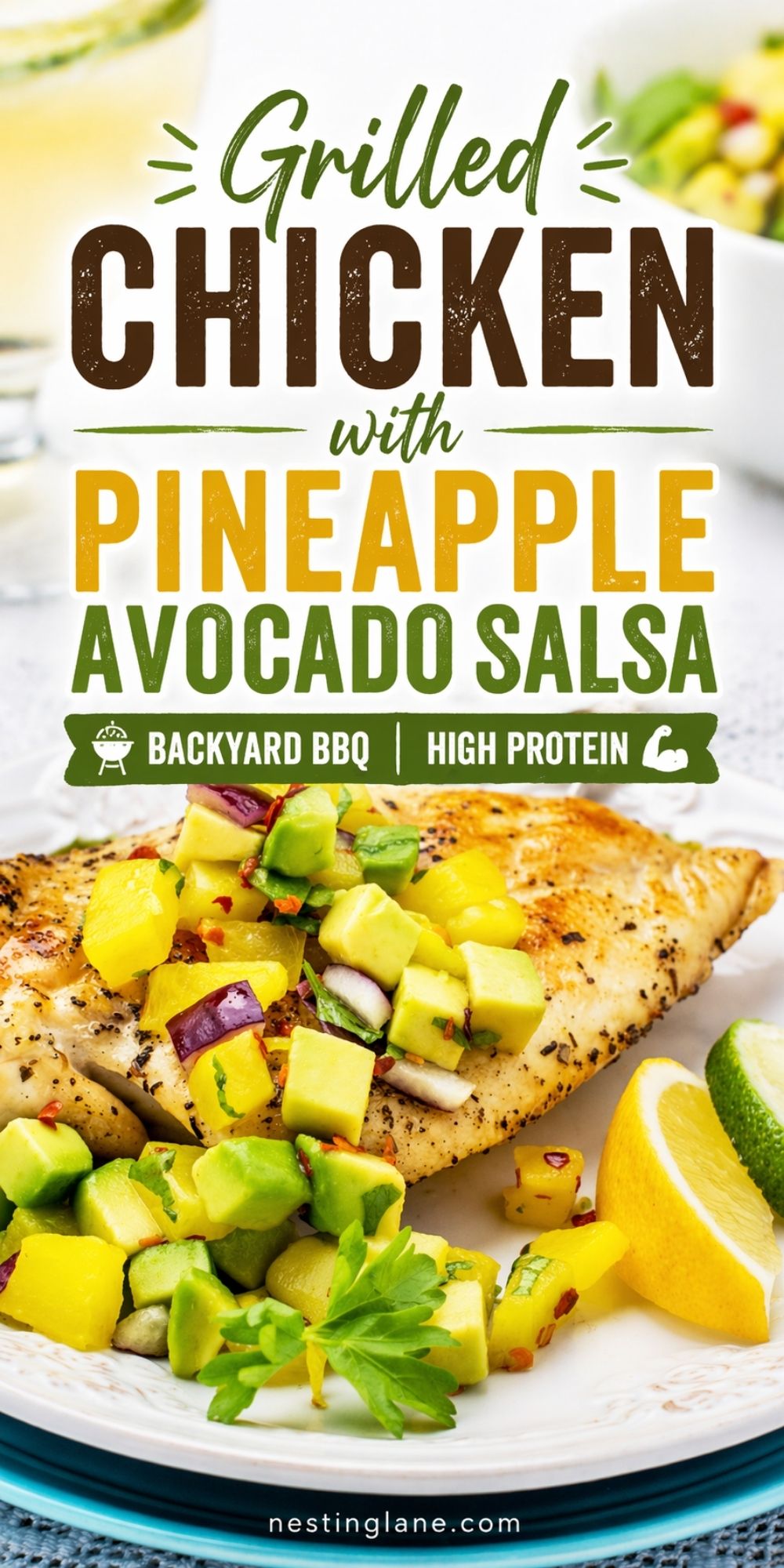 Grilled chicken breast topped with pineapple avocado salsa, red onion, herbs, and chili flakes on a white plate with lemon and lime wedges. Text reads “Grilled Chicken with Pineapple Avocado Salsa,” “Backyard BBQ,” “High Protein,” and “nestinglane.com.”