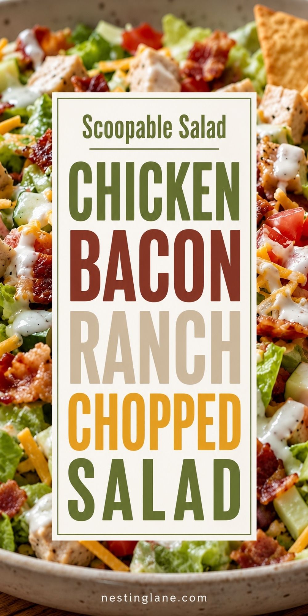Scoopable salad with chopped chicken, bacon, ranch dressing, lettuce, cucumbers, tomatoes, cheddar cheese, and pita chips in a bowl. Text reads: “Scoopable Salad Chicken Bacon Ranch Chopped Salad” and “nestinglane.com.”