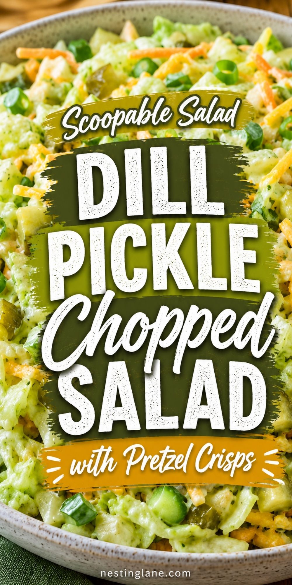 Scoopable salad pin showing dill pickle chopped salad with ranch, lettuce, pickles, cucumber, carrots, cheddar, and green onions. Text reads “Scoopable Salad Dill Pickle Chopped Salad with Pretzel Crisps” and “nestinglane.com.”