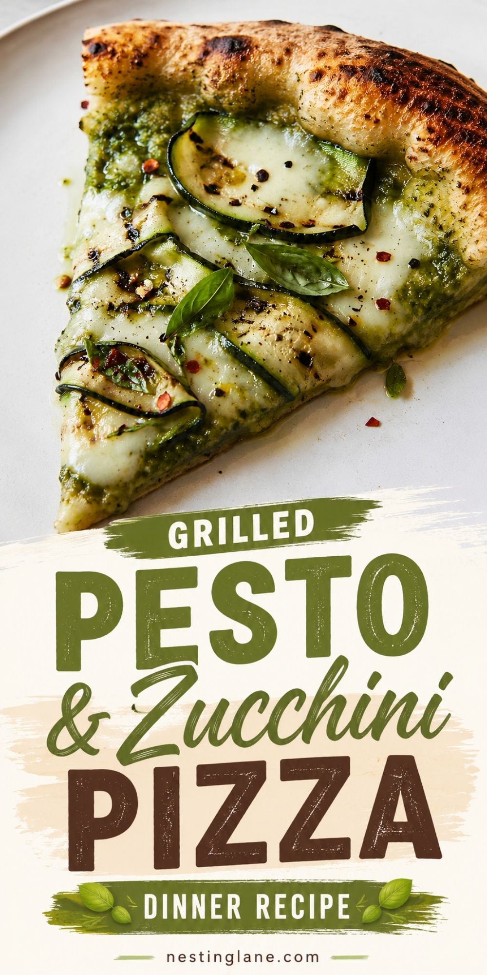 Slice of grilled pesto and zucchini pizza with charred crust, zucchini ribbons, basil, and red pepper flakes. Text reads “Grilled Pesto & Zucchini Pizza Dinner Recipe” and “nestinglane.com.”