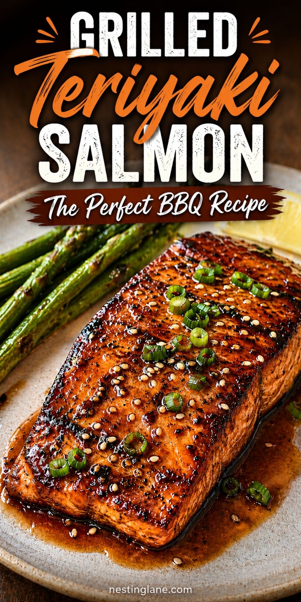 Grilled teriyaki salmon glazed with sauce, sesame seeds, and sliced green onions, served on a plate with grilled asparagus and lemon. Text reads “Grilled Teriyaki Salmon The Perfect BBQ Recipe” with “nestinglane.com” at the bottom.