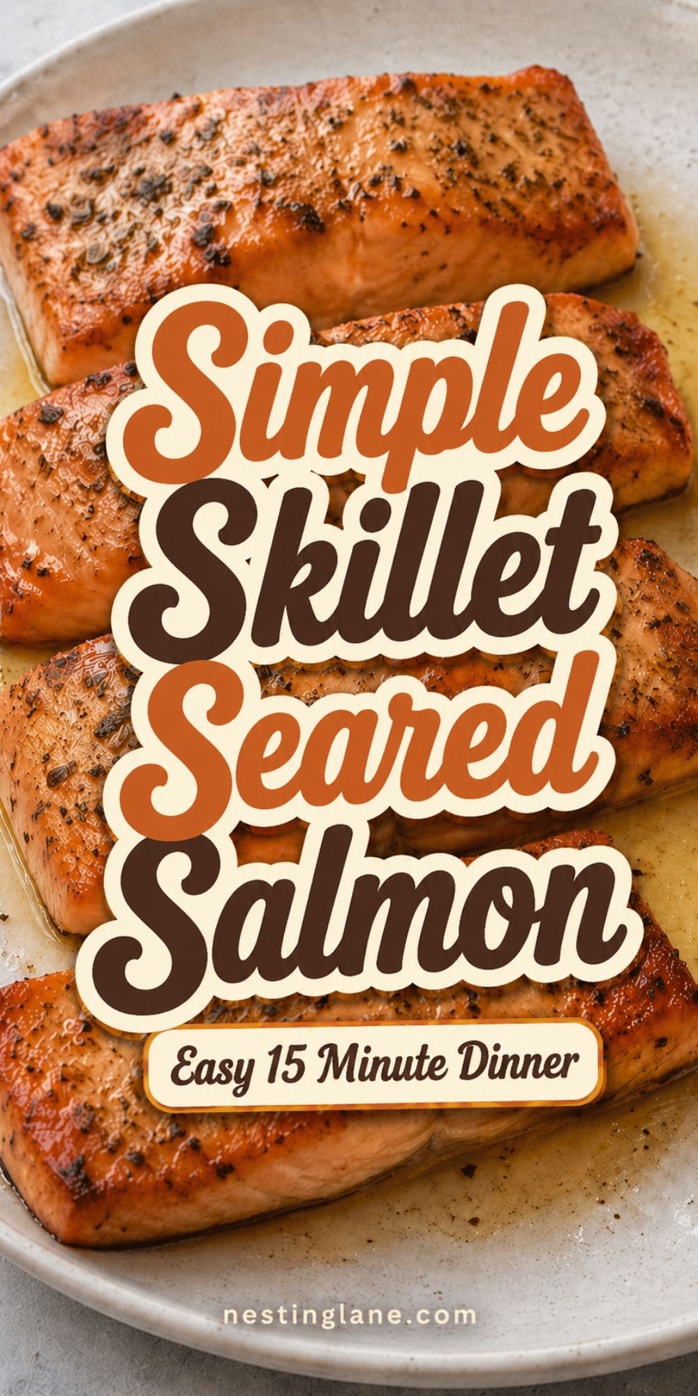 Simple Skillet Seared Salmon fillets in a pan with browned seasoning and pan sauce. Text reads “Simple Skillet Seared Salmon,” “Easy 15 Minute Dinner,” and “nestinglane.com.”