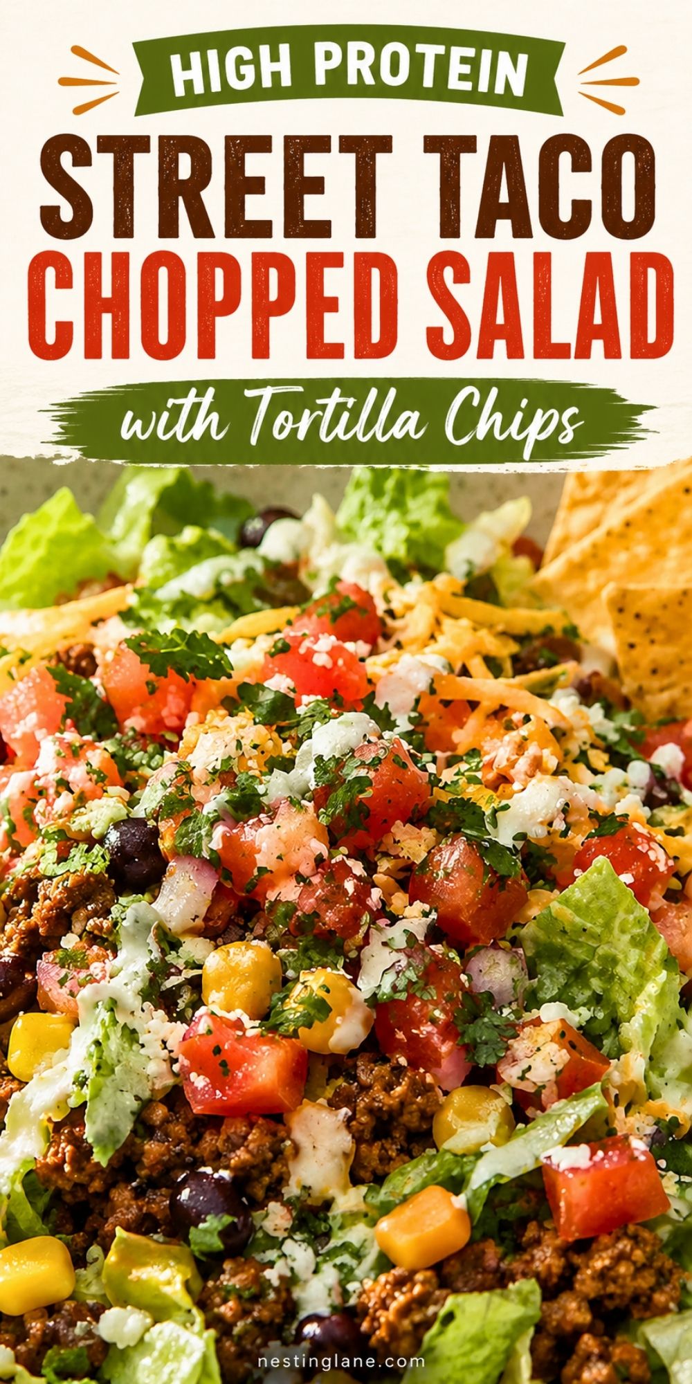 Pinterest-style pin showing a high-protein street taco chopped salad with tortilla chips. The salad features chopped romaine, seasoned ground beef, corn, black beans, diced tomatoes, shredded cheese, cilantro, and a creamy dressing drizzle. Text overlay reads: “High Protein Street Taco Chopped Salad with Tortilla Chips,” with the website nestinglane.com at the bottom.