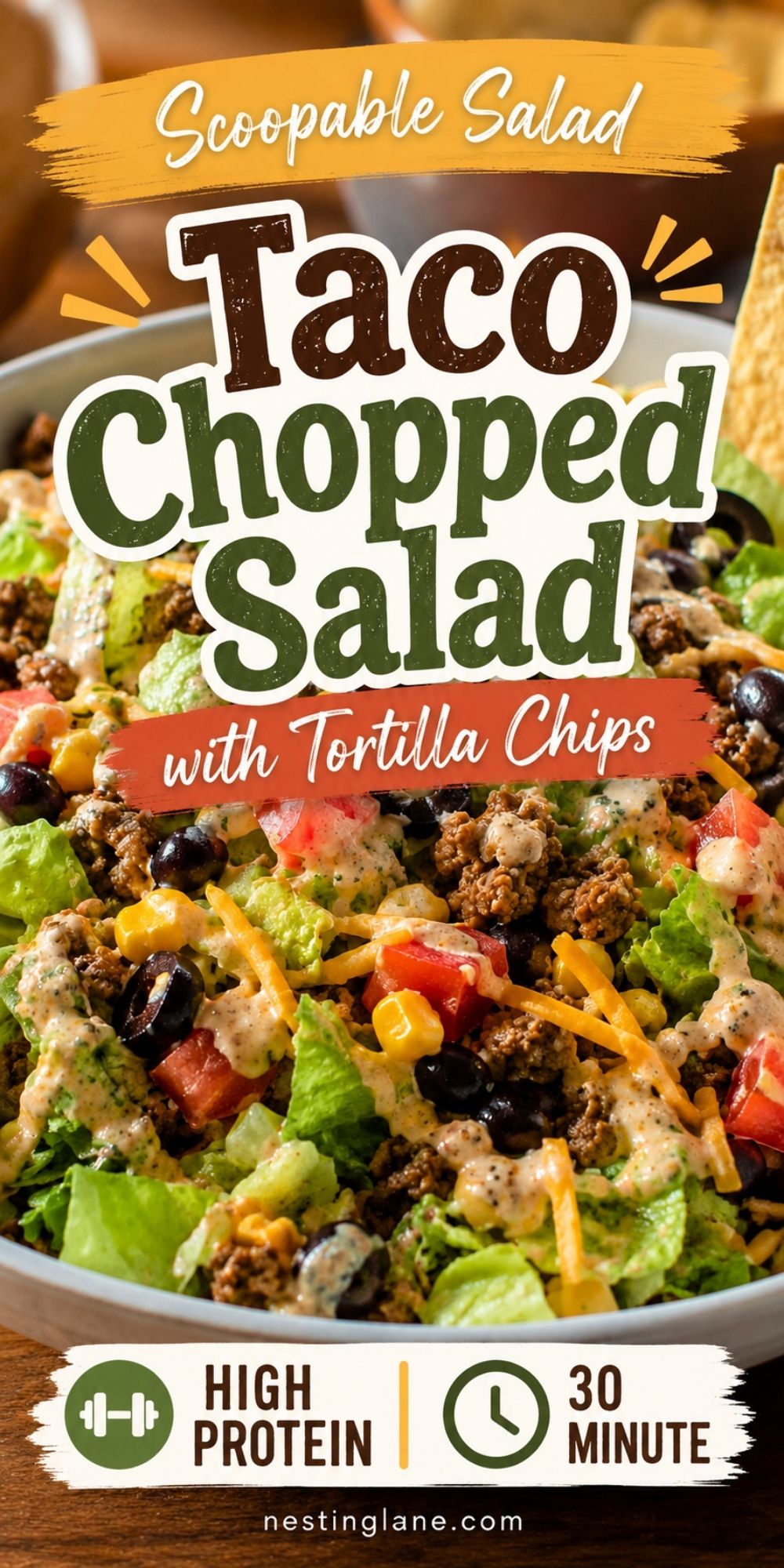 Taco chopped salad with lettuce, seasoned beef, black beans, corn, tomatoes, cheddar, creamy dressing, and tortilla chips. Text reads “Scoopable Salad Taco Chopped Salad with Tortilla Chips,” “High Protein,” “30 Minute,” and “nestinglane.com.”