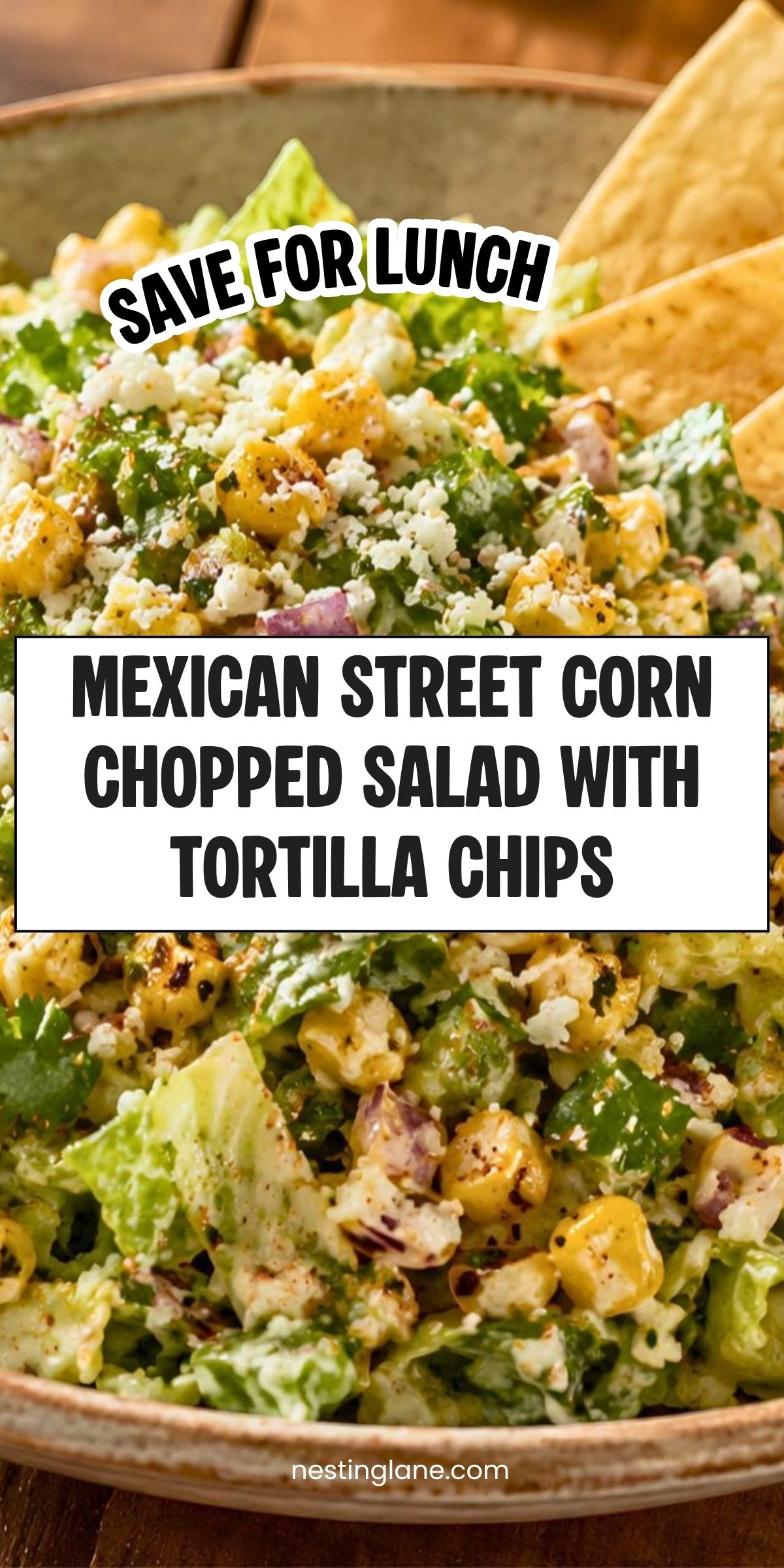 Mexican street corn chopped salad in a bowl with romaine, charred corn, creamy dressing, crumbled cheese, herbs, and tortilla chips. Text reads: āSave for Lunch. Mexican Street Corn Chopped Salad with Tortilla Chips. nestinglane.comā