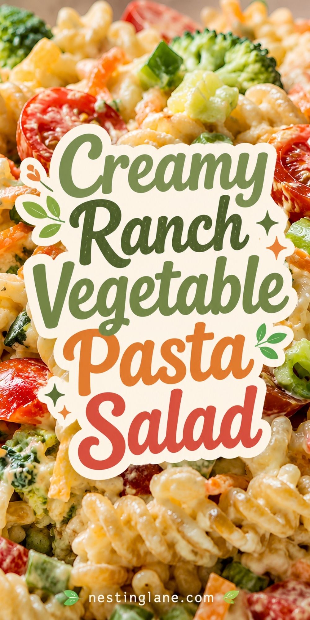 Creamy ranch vegetable pasta salad with rotini pasta, cherry tomatoes, broccoli, carrots, celery, and green peppers in a creamy dressing. Text reads “Creamy Ranch Vegetable Pasta Salad” and “nestinglane.com.”