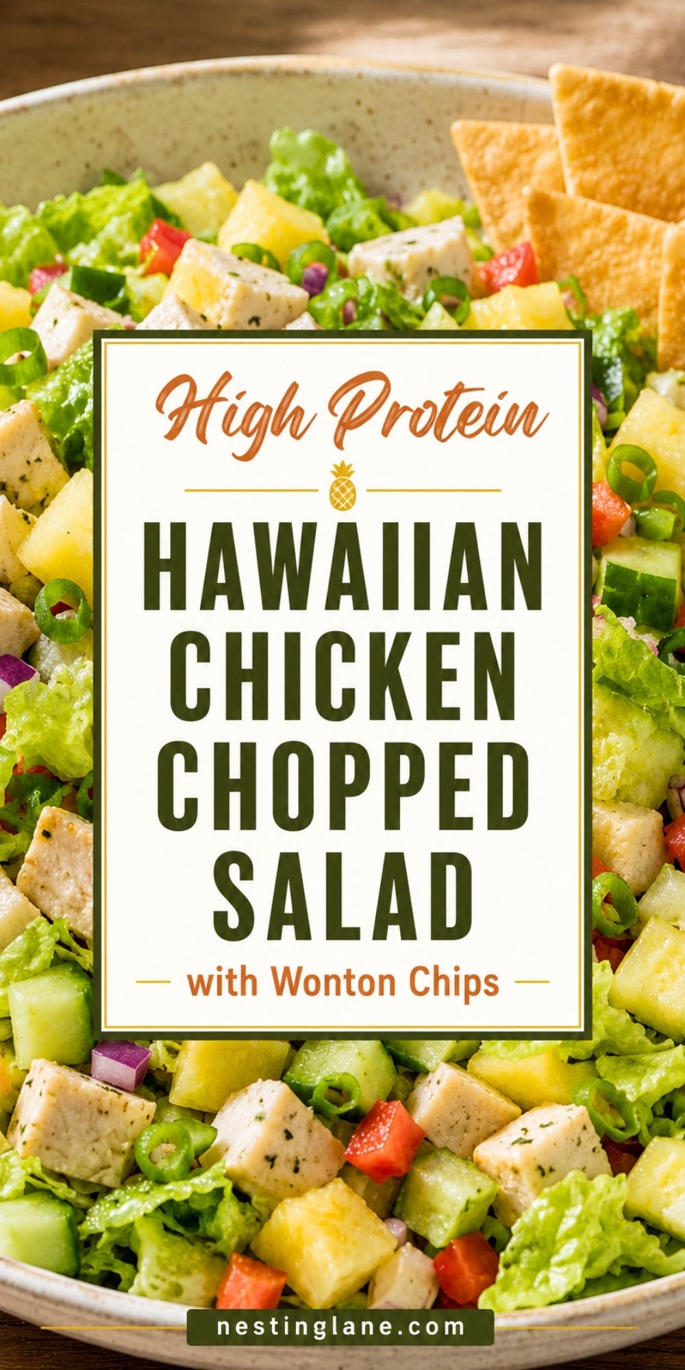 High protein Hawaiian chicken chopped salad with romaine, chicken, pineapple, cucumber, red pepper, green onion, and wonton chips. Text reads: “High Protein Hawaiian Chicken Chopped Salad with Wonton Chips” and “nestinglane.com.”
