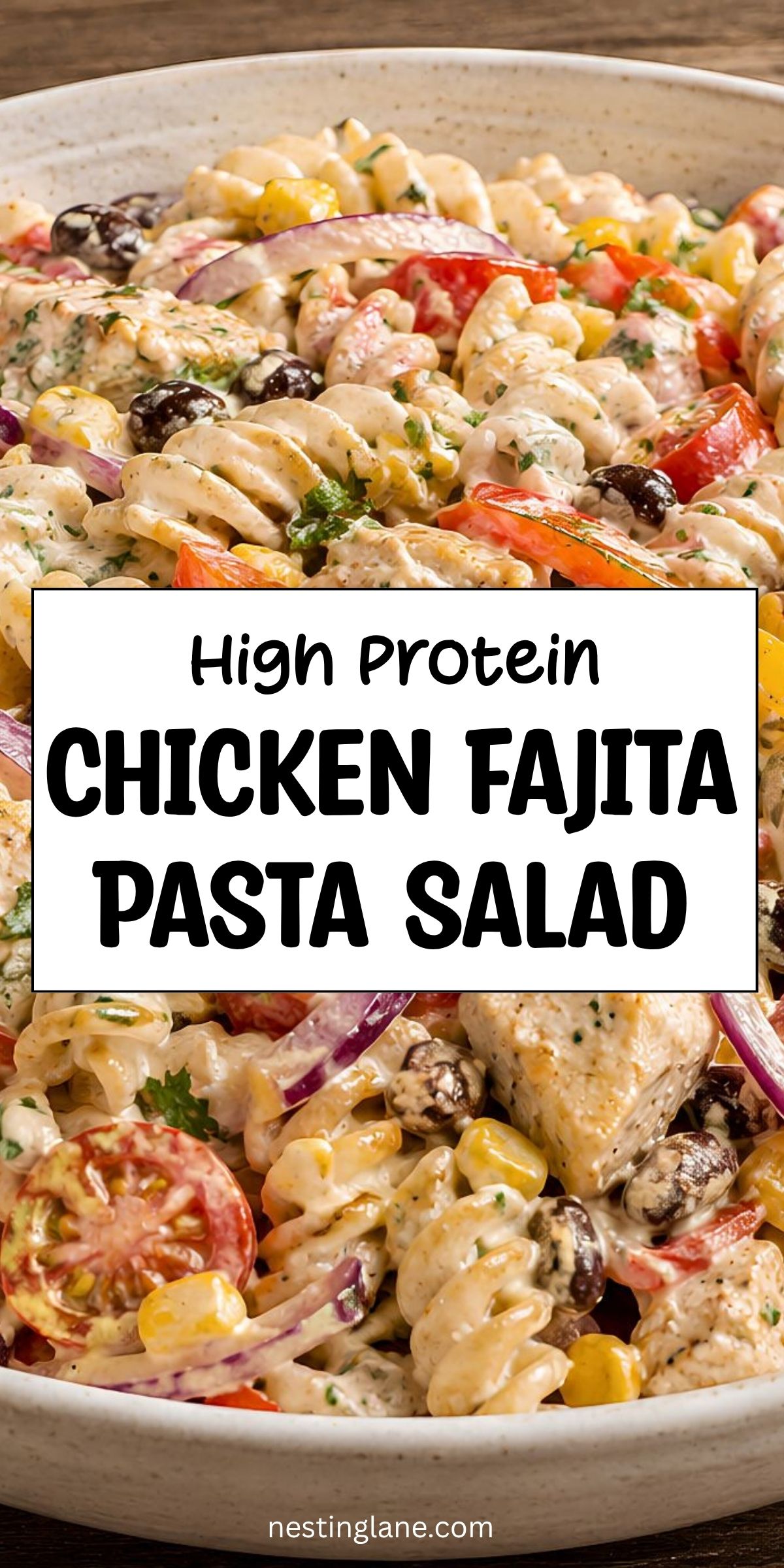 Creamy high protein chicken fajita pasta salad with rotini, grilled chicken, black beans, corn, tomatoes, red onion, and herbs. Text reads “High Protein Chicken Fajita Pasta Salad” and “nestinglane.com.”