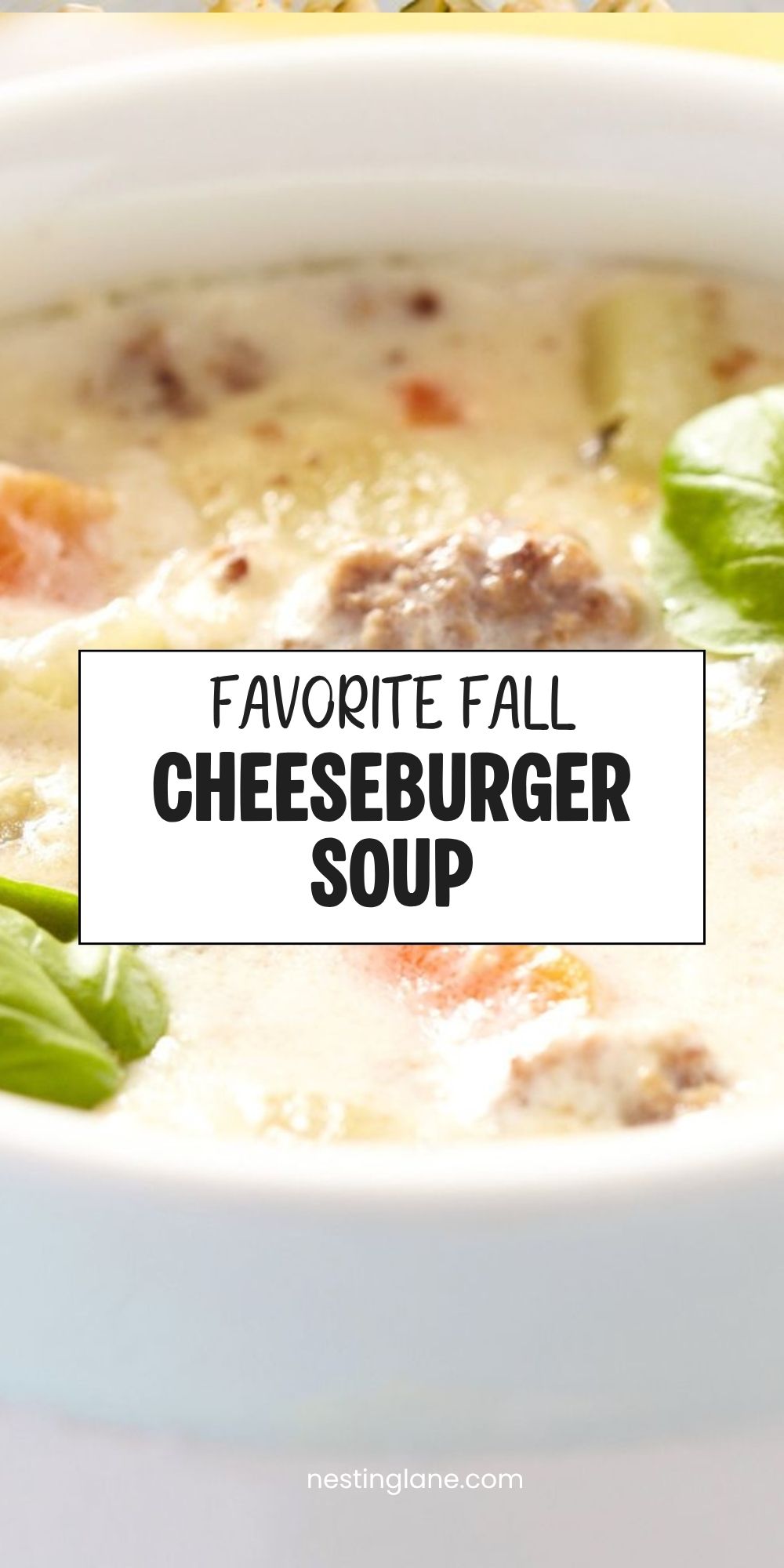 Creamy cheeseburger soup with ground beef, potatoes, carrots, and green garnish in a white bowl. Text reads “Favorite Fall Cheeseburger Soup” and “nestinglane.com.”