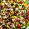 Chicken bacon grinder chopped salad with romaine, seasoned chicken breast, turkey bacon, provolone, cucumbers, cherry tomatoes, banana peppers, black olives, red onion, parsley, and creamy grinder dressing.
