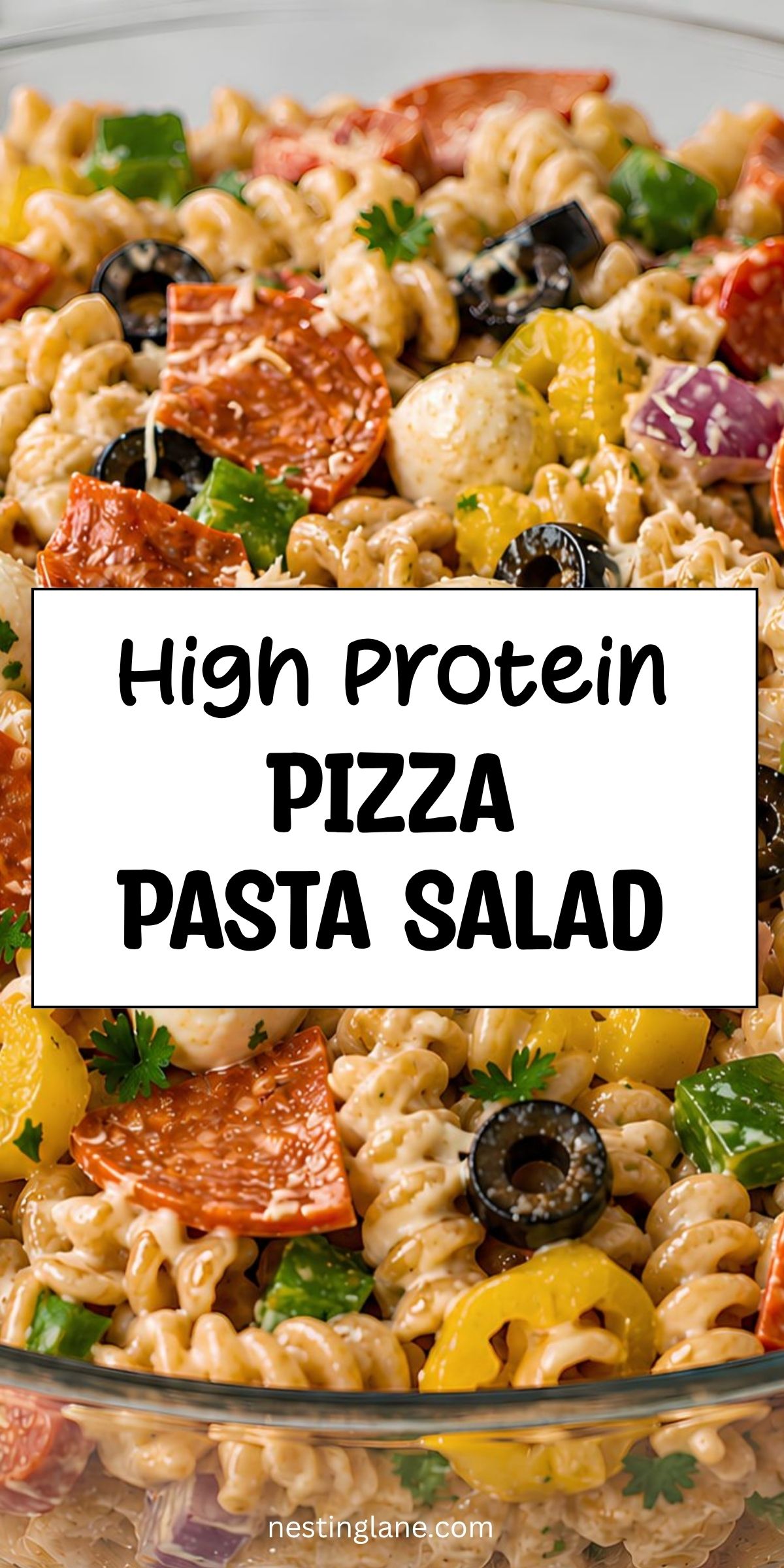 High protein pizza pasta salad with rotini, turkey pepperoni, mozzarella pearls, black olives, green peppers, banana peppers, red onion, parsley, and creamy dressing. Text reads “High Protein Pizza Pasta Salad” and “nestinglane.com.”