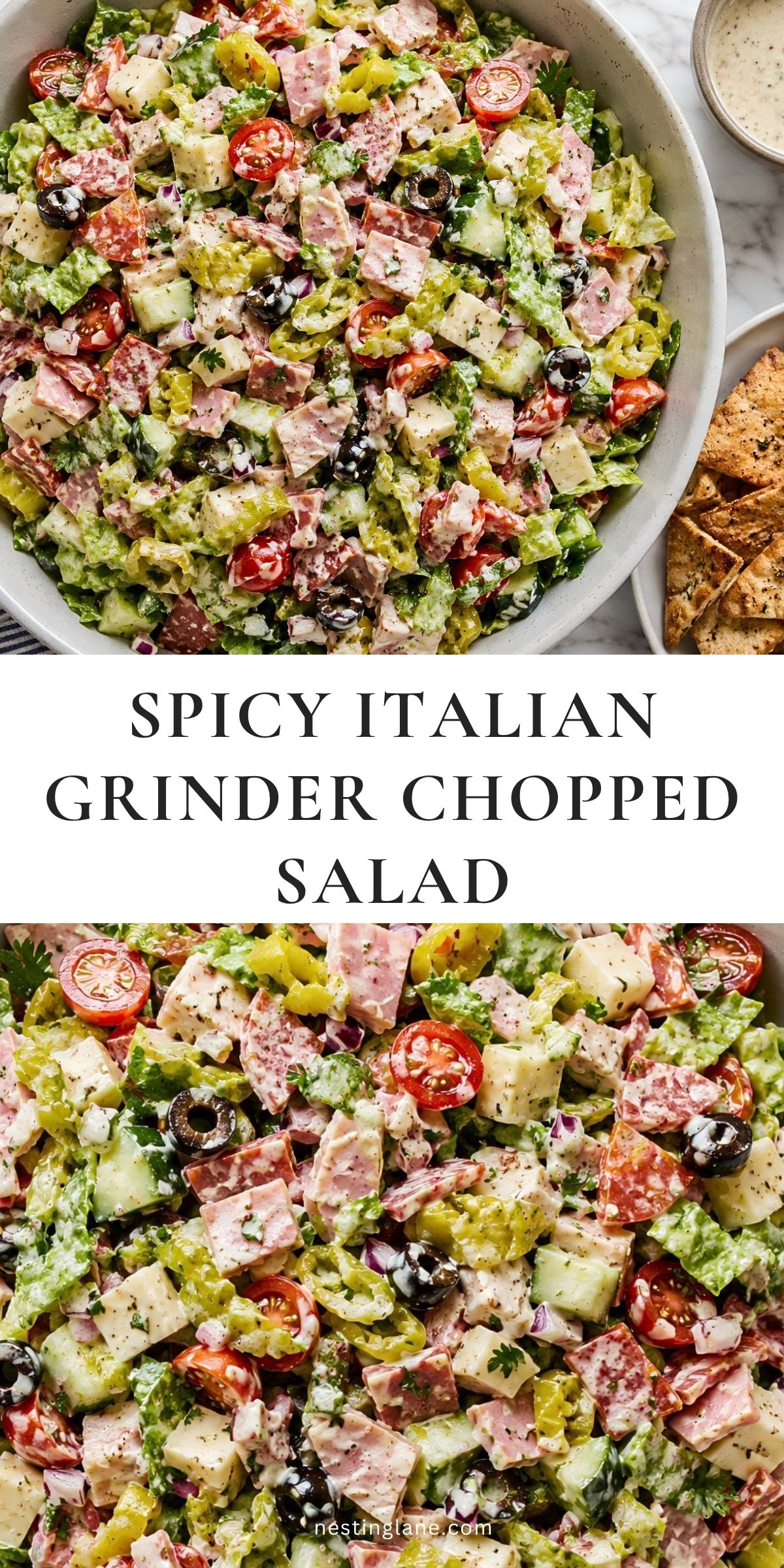 A creamy Spicy Italian Grinder Chopped Salad with romaine, salami, ham, pepperoni, provolone, cherry tomatoes, cucumbers, banana peppers, black olives, and garlic pita chips. Text reads “SPICY ITALIAN GRINDER CHOPPED SALAD” and “nestinglane.com.”