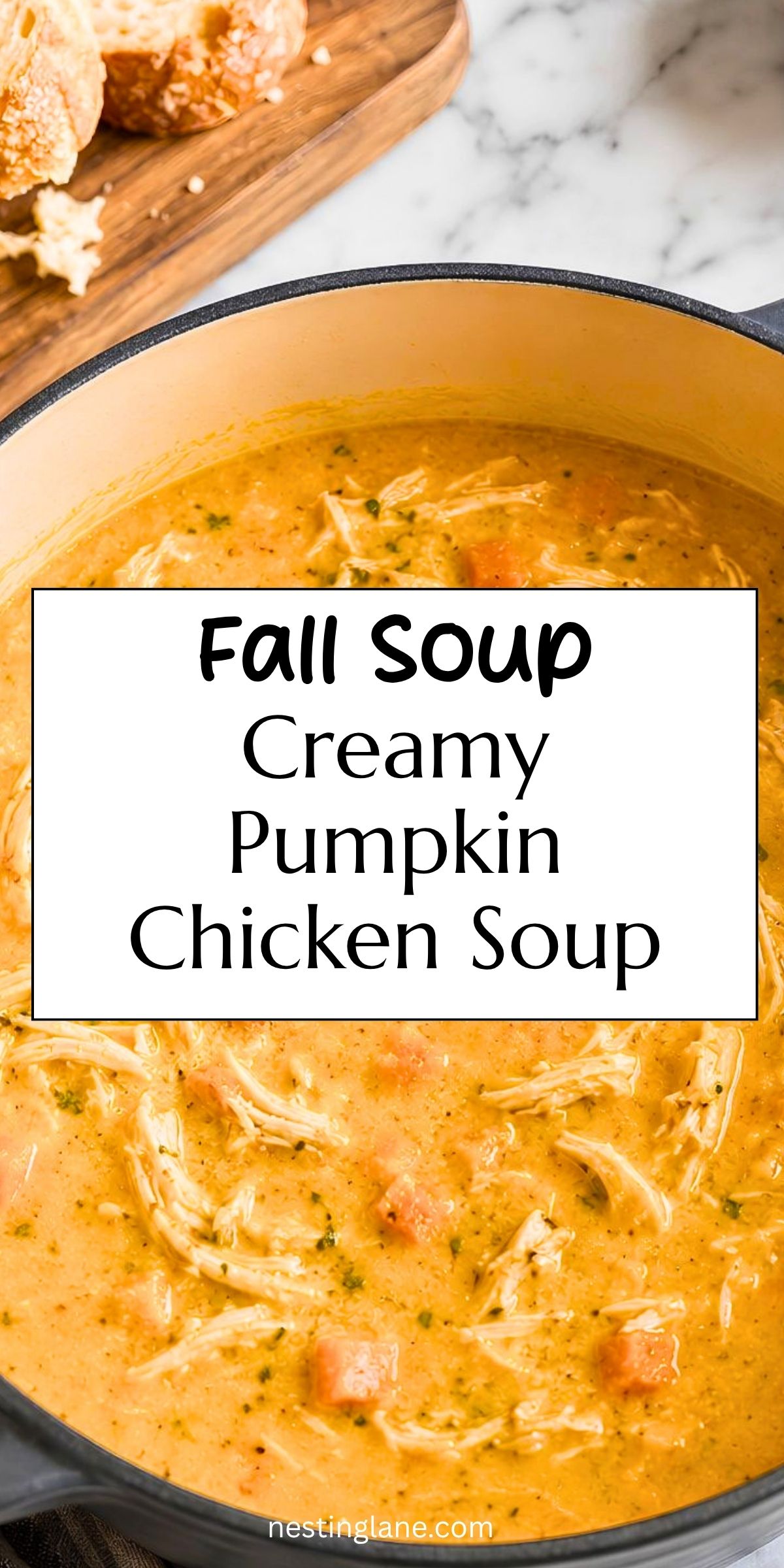 Creamy pumpkin chicken soup with shredded chicken and carrots in a Dutch oven. Text reads: “Fall Soup Creamy Pumpkin Chicken Soup” with “nestinglane.com” at the bottom.