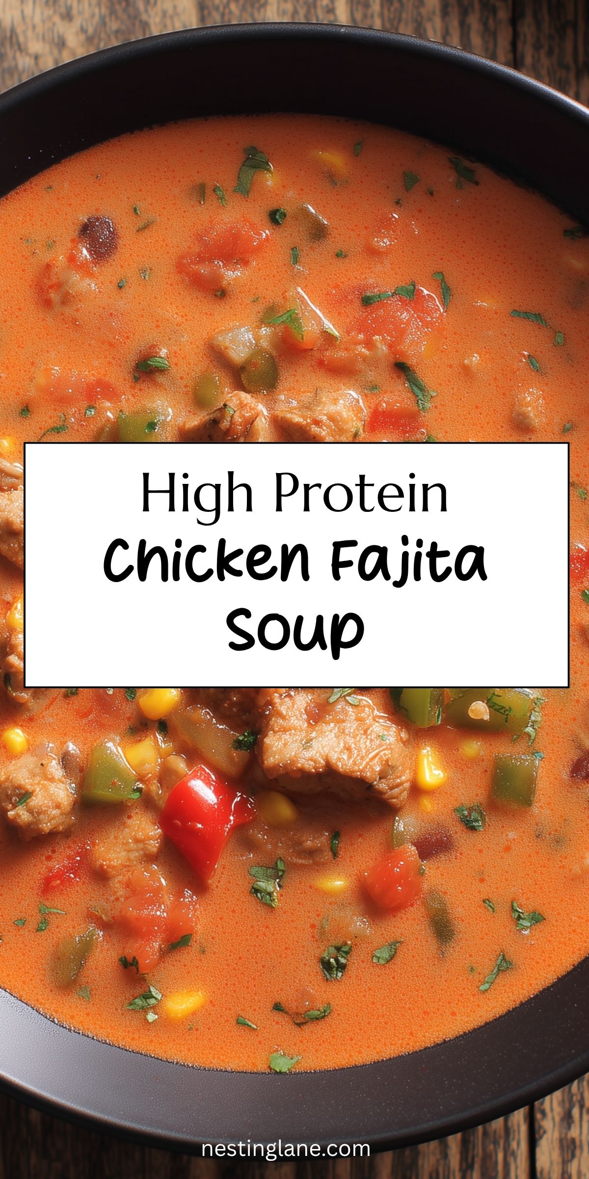 Pinterest graphic showing creamy chicken fajita soup with chicken, bell peppers, corn, black beans, and tomatoes. Text reads “High Protein Chicken Fajita Soup” and “nestinglane.com.”