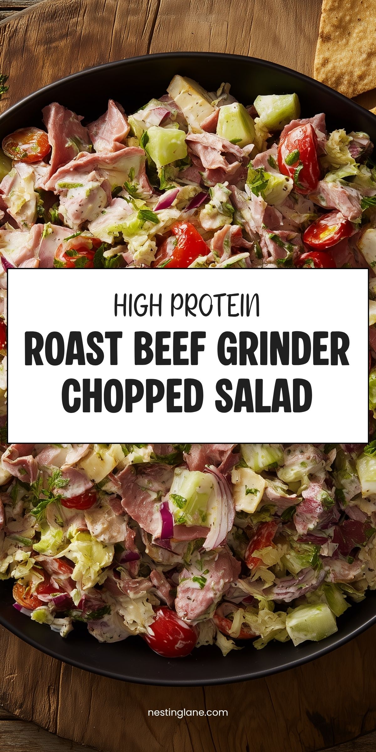 High protein roast beef grinder chopped salad with lettuce, tomatoes, cucumber, red onion, cheese, and creamy dressing. Text reads: “High Protein Roast Beef Grinder Chopped Salad” and “nestinglane.com.”