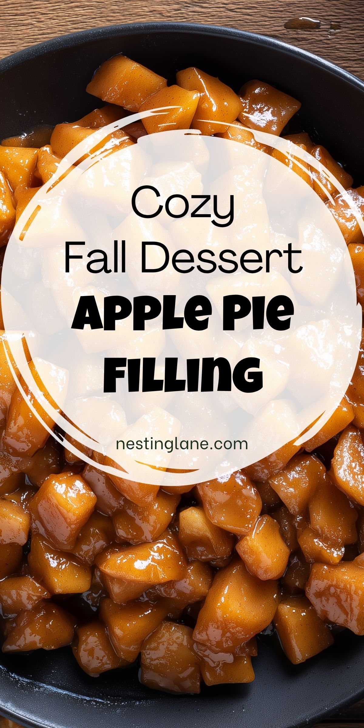 Cozy fall dessert pin with glossy cinnamon apple pie filling in a black bowl. Text reads: “Cozy Fall Dessert APPLE PIE FILLING nestinglane.com.”