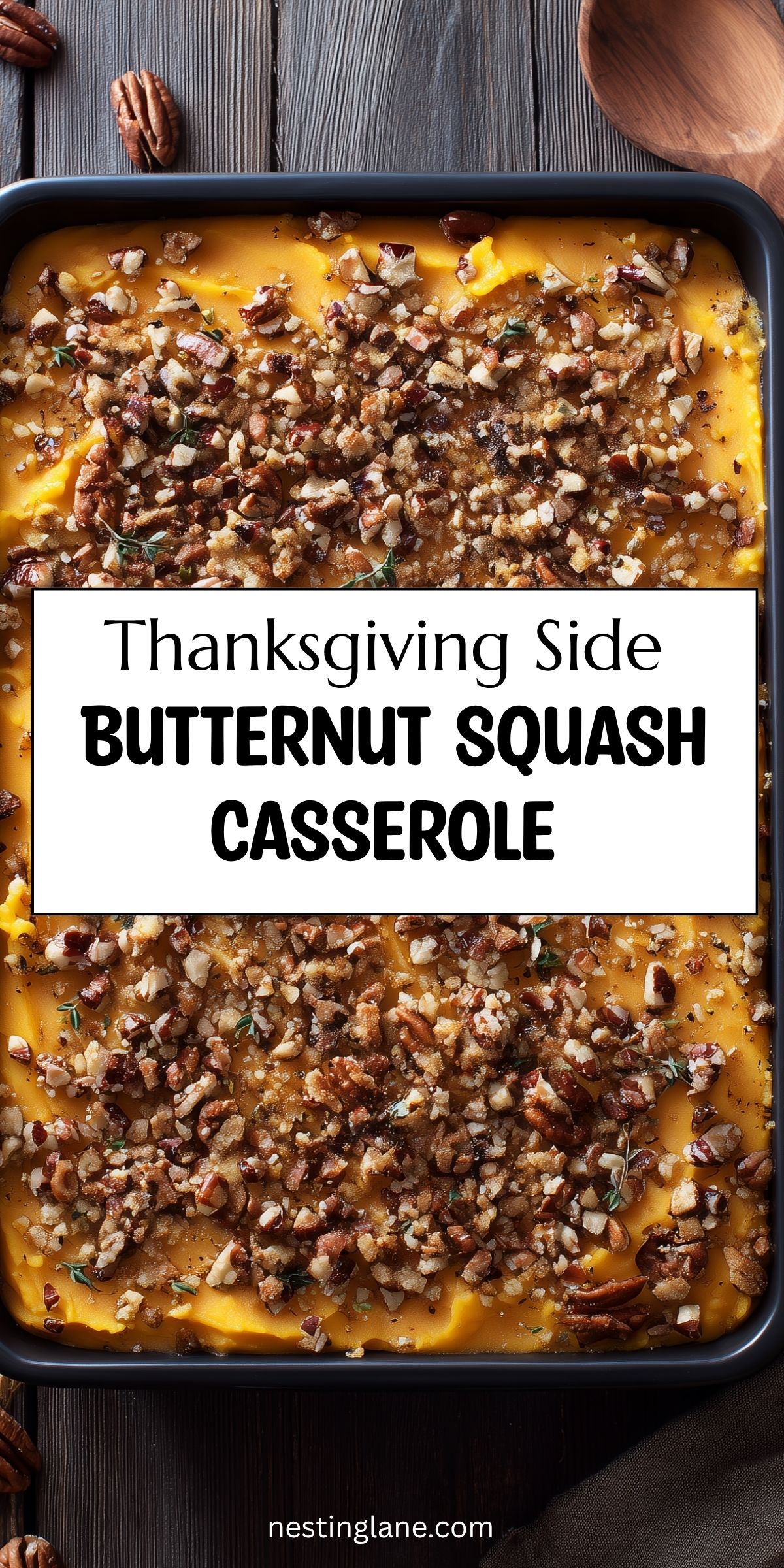 Thanksgiving side butternut squash casserole topped with chopped pecans and breadcrumbs. Text reads: “Thanksgiving Side Butternut Squash Casserole” and “nestinglane.com.”