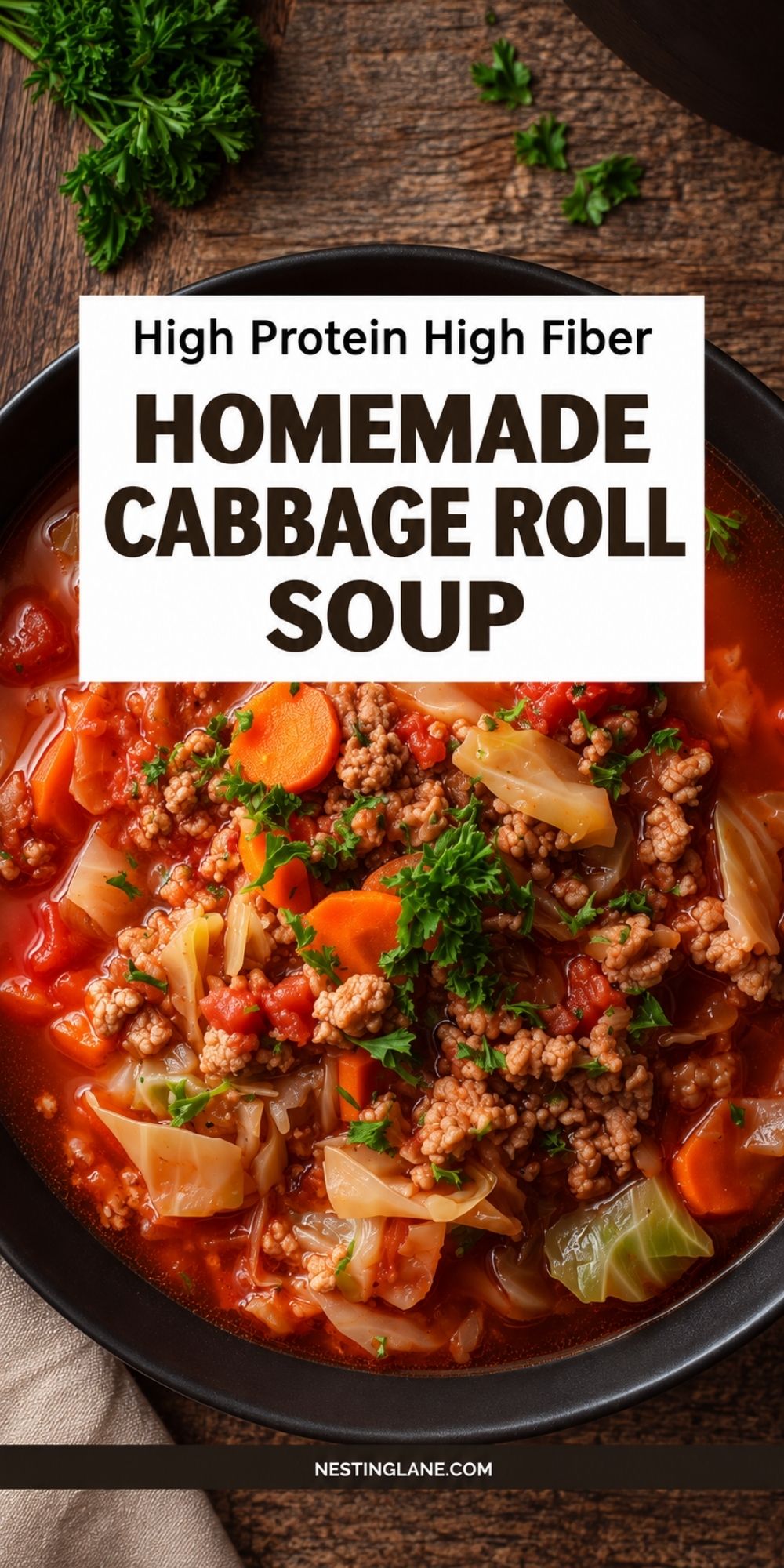 Pinterest pin with a black bowl of cabbage roll soup made with ground turkey, cabbage, carrots, and tomatoes. Text reads “High Protein High Fiber Homemade Cabbage Roll Soup” and “NestingLane.com.”