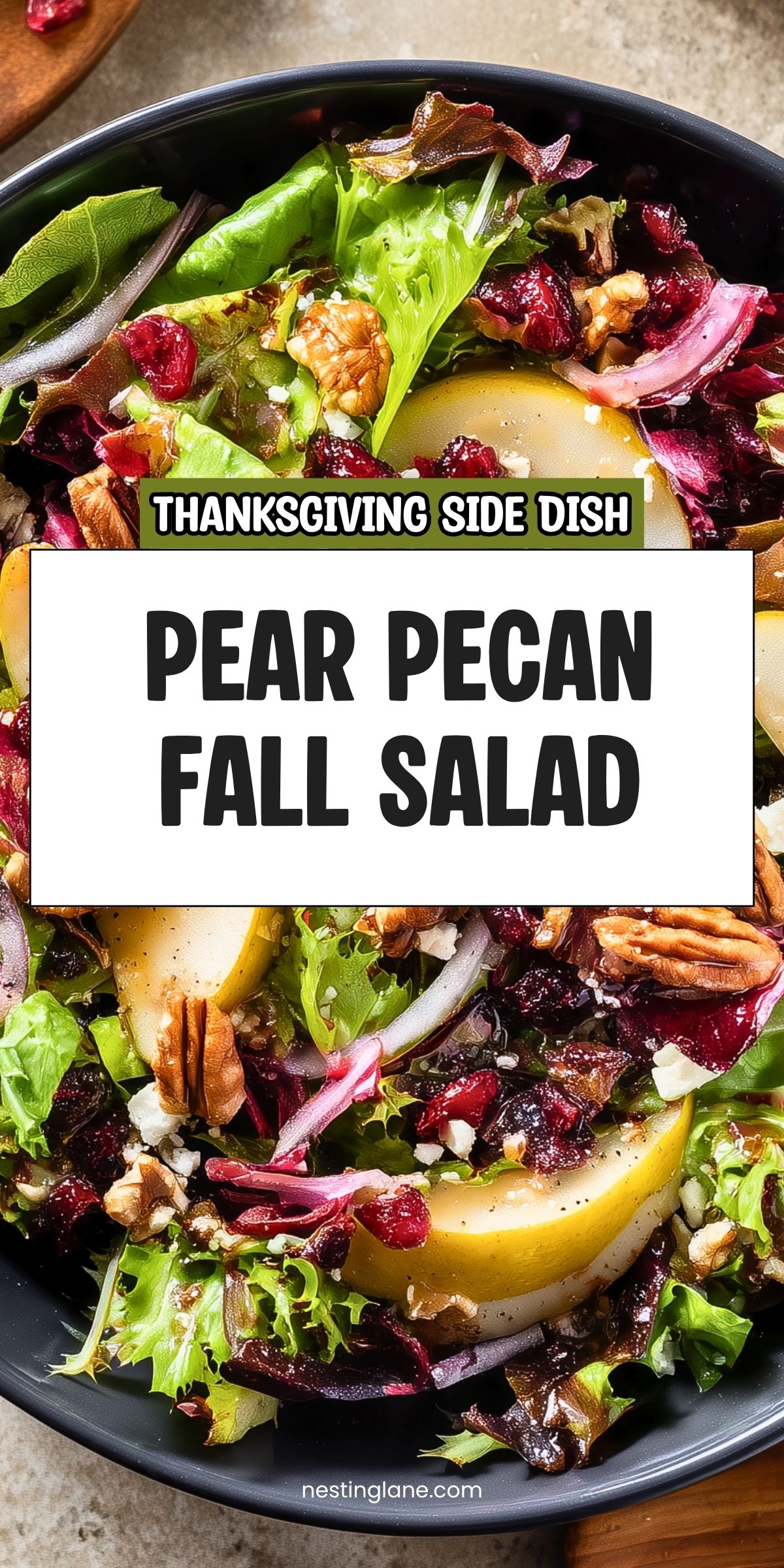 Pear pecan fall salad with mixed greens, sliced pears, dried cranberries, pecans, feta, and red onion. Text reads “Thanksgiving Side Dish” and “Pear Pecan Fall Salad,” with nestinglane.com at the bottom.