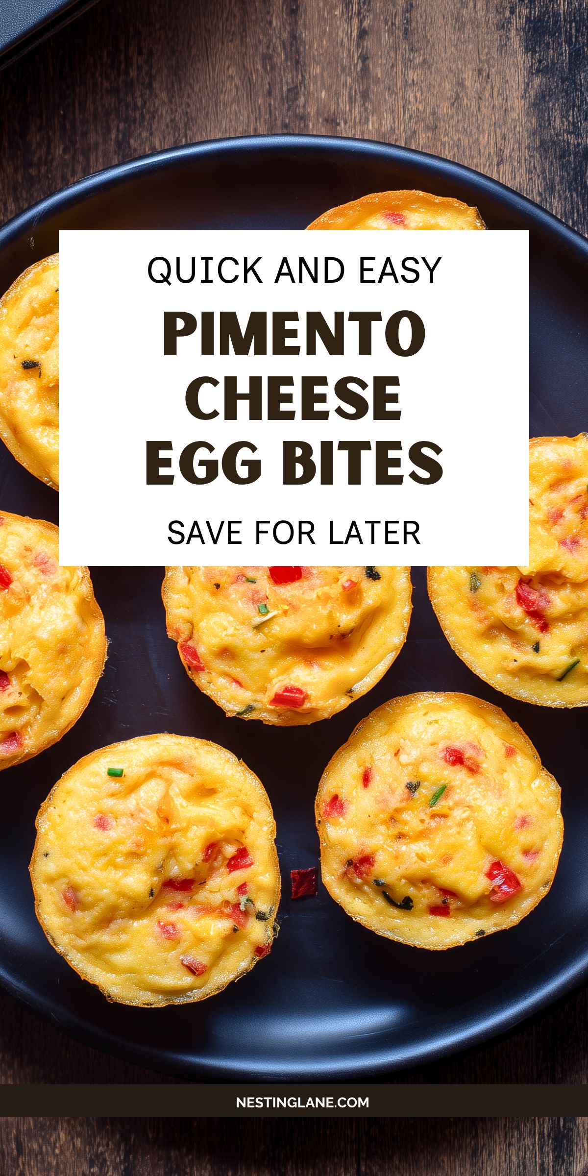 Overhead view of golden pimento cheese egg bites with red pimentos and green onions on a black plate. Text reads: “QUICK AND EASY PIMENTO CHEESE EGG BITES SAVE FOR LATER” and “NESTINGLANE.COM.”