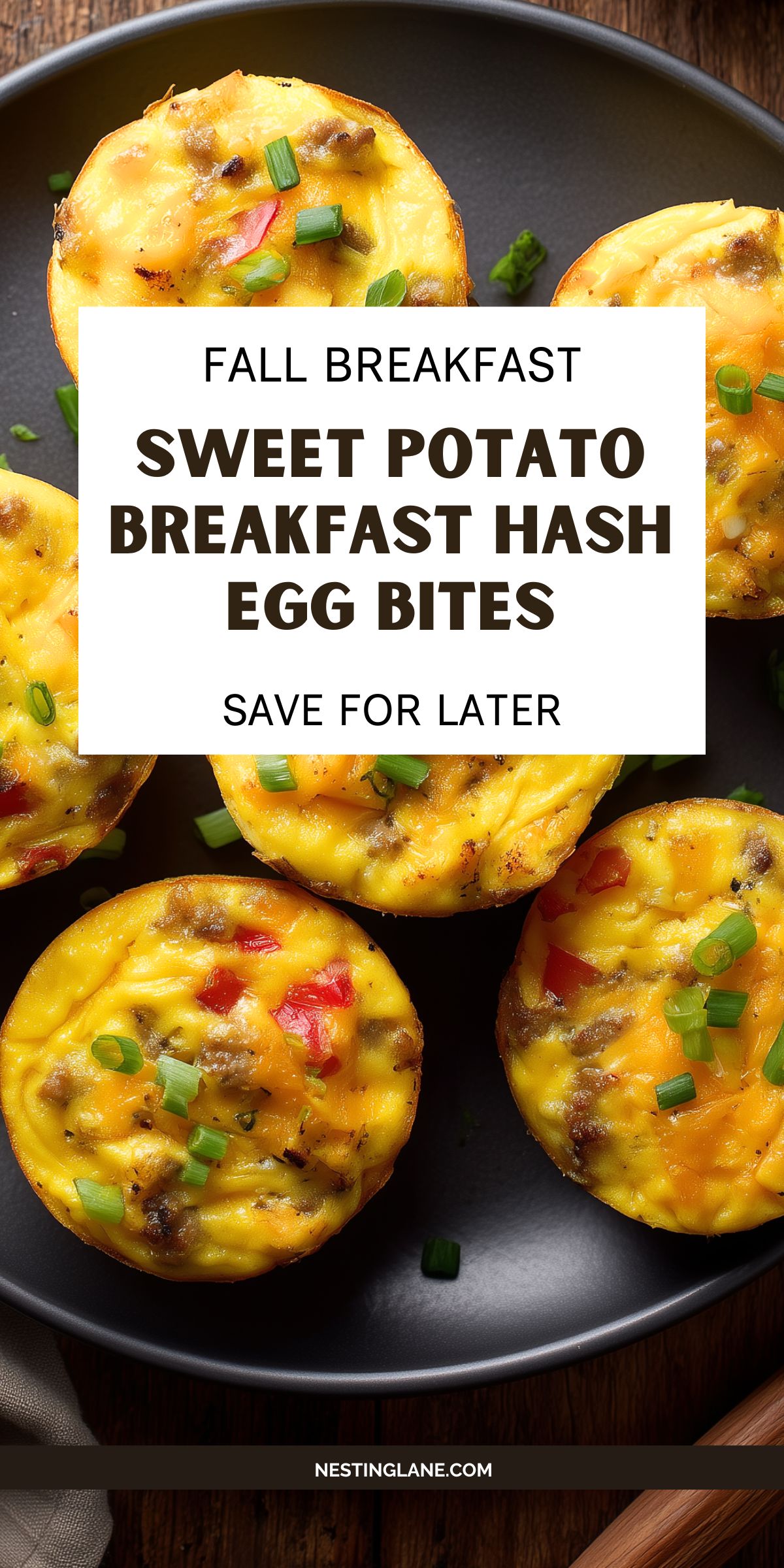 Sweet potato breakfast hash egg bites with sausage, red bell pepper, cheddar, and green onions on a black plate. Text reads: “Fall Breakfast Sweet Potato Breakfast Hash Egg Bites. Save for Later. NestingLane.com.”