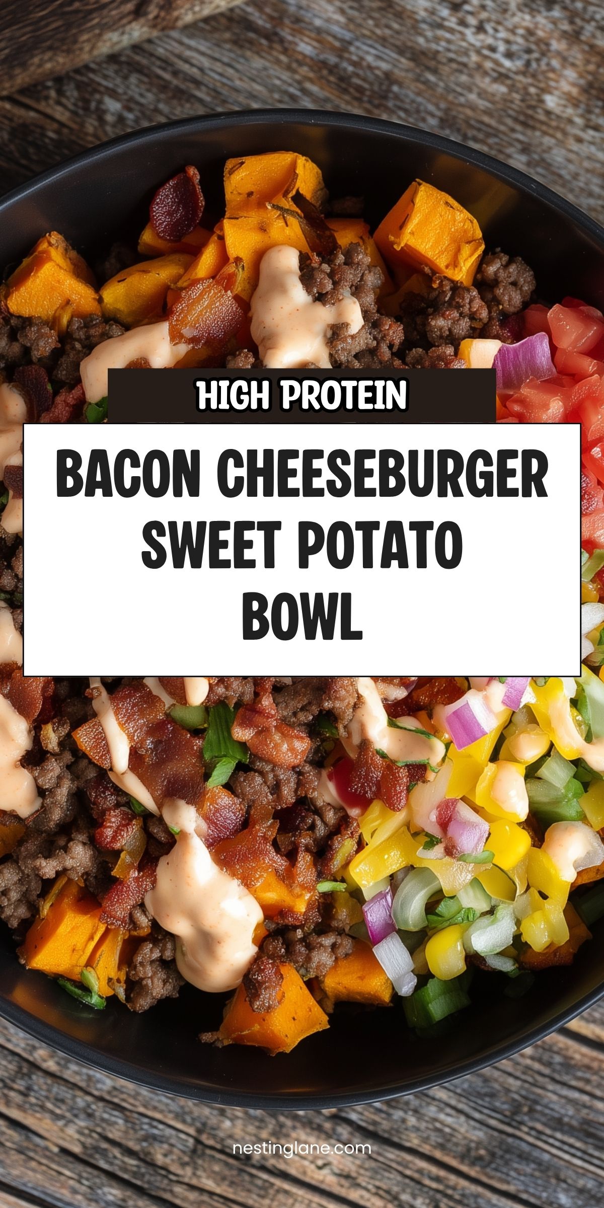 High Protein Bacon Cheeseburger Sweet Potato Bowl with roasted sweet potato cubes, seasoned ground beef, crispy bacon, shredded cheese, diced tomatoes, red onions, and creamy burger sauce in a black bowl. Text reads "HIGH PROTEIN BACON CHEESEBURGER SWEET POTATO BOWL" and "nestinglane.com."