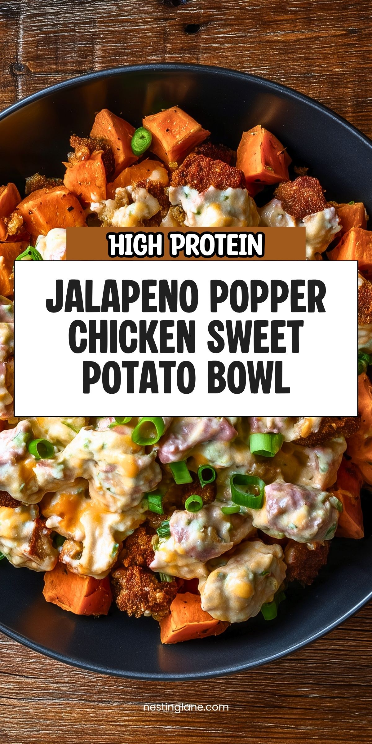 High Protein Jalapeno Popper Chicken Sweet Potato Bowl with roasted sweet potatoes, creamy chicken, melted cheese and green onions. Text reads “High Protein Jalapeno Popper Chicken Sweet Potato Bowl” and “nestinglane.com.”